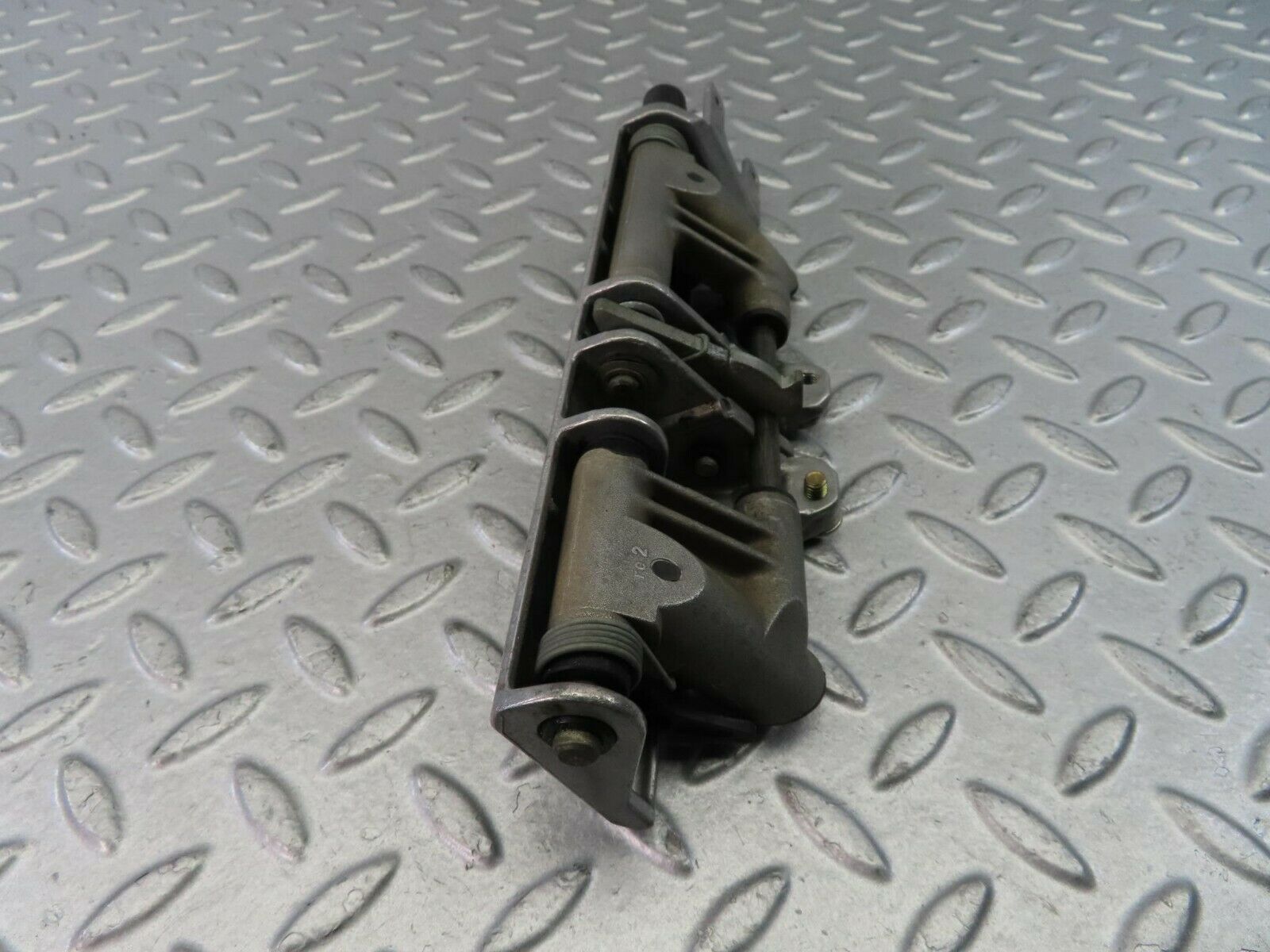 9319 Mercedes-Benz C124 300CE Coupe Headrest Folding Mechanism 1249700025