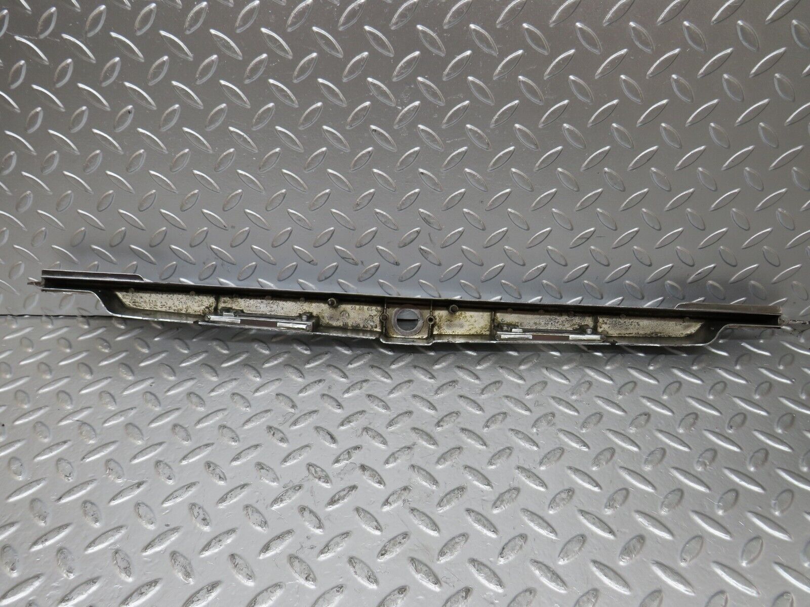 26038 Mercedes-Benz W116 450SE number Plate Light Holder Moulding 1166900580