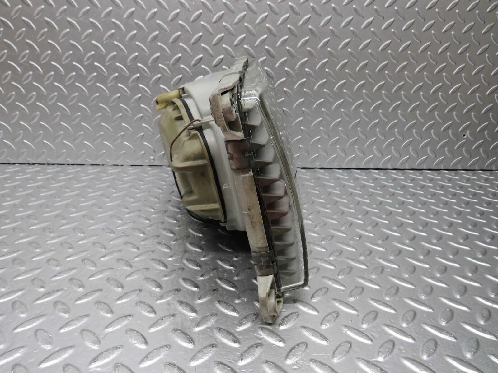 31058 Mercedes-Benz W123 200D Headlight Hella Left Side 117683-00