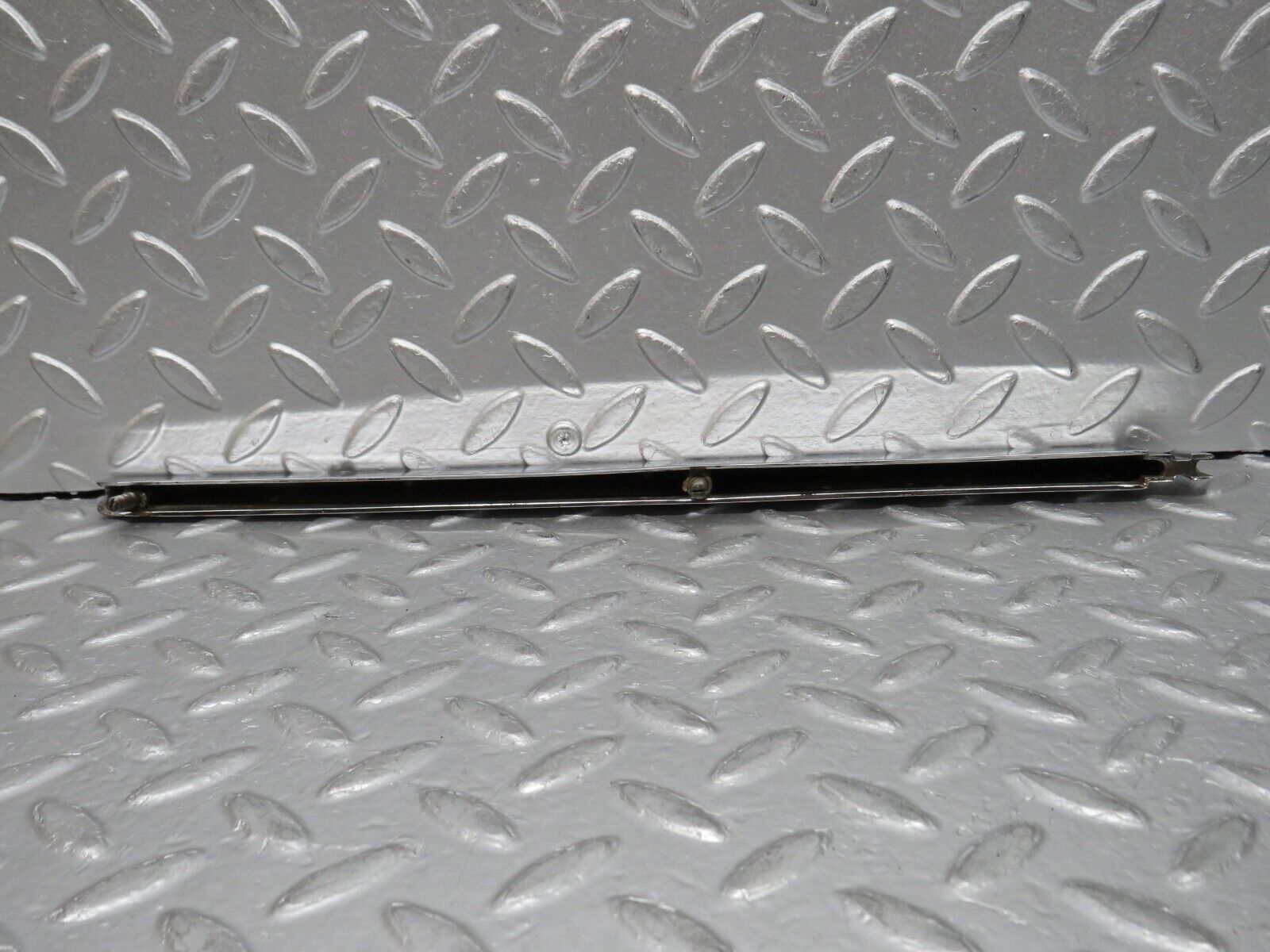 0664 Mercedes-Benz C107 350SLC Coupe Trunk Chrome Handle Moulding Left 1076901380