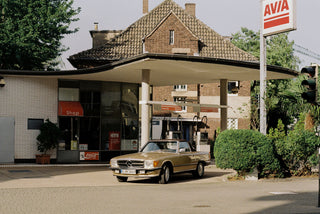 Classic Mercedes car  in front of the gas station