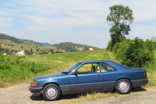 Mercedes W124 classic blue coupe side view photo