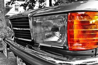 Mercedes W126 classic headlight orange indicator selective color close-up photo