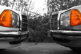 Mercedes W123 classic headlights orange indicators selective color close-up photo