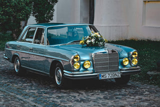 Mercedes W108 classic blue saloon car yellow headlights wedding photo