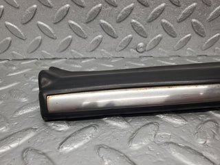 W123 Lang front left lower moulding trim used OEM