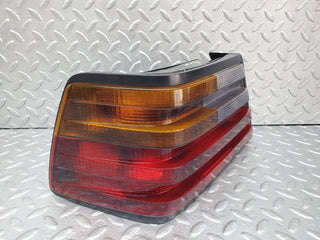 W124 tail light left side used OEM