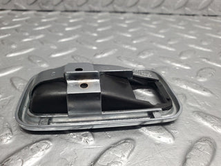 W123 chrome frame door opener left used OEM