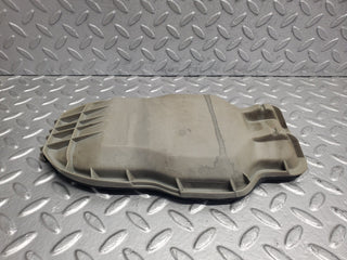 W123 headlight bulb cover left side used OEM