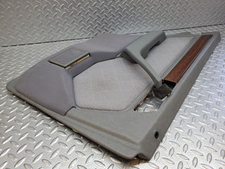 W124 rear left door card grey used OEM