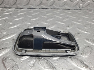 W123 chrome frame door opener right used OEM