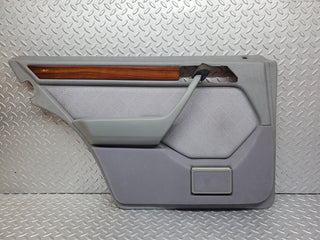 W124 rear left door card grey used OEM