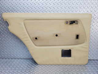 W123 rear left door card beige used OEM