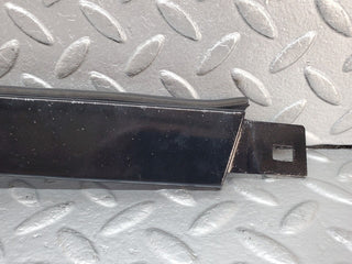 W124 under headlight trim left side used OEM