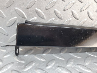 W124 under headlight trim left side used OEM