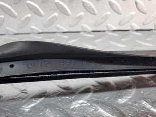 W124 under headlight trim right side used OEM