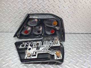 W124 tail light left side used OEM