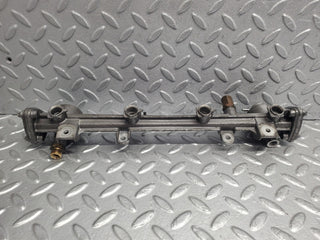 W124 Wagon fuel injector rail used OEM