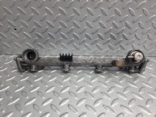 W124 Wagon fuel injector rail used OEM