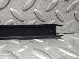 W201 Baby Benz under headlight trim left used OEM