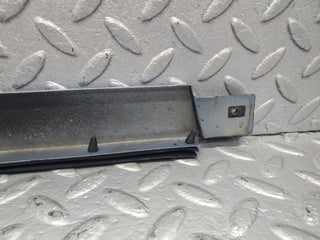 W124 Cabriolet under headlight trim left side used OEM