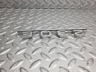 W123 trunk badge logo emblem used OEM