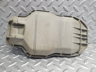W123 headlight bulb cover left side used OEM