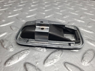 W123 chrome frame door opener left used OEM