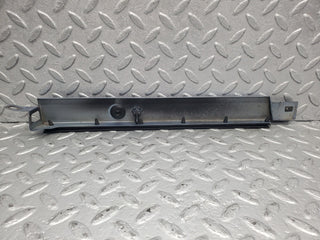 W124 Cabriolet under headlight trim left side used OEM
