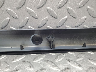 W124 Cabriolet under headlight trim left side used OEM