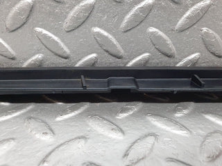 W202 under headlight trim right used OEM