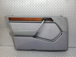 W124 front left door card grey used OEM