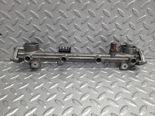 W124 Wagon fuel injector rail used OEM