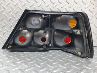 W124 tail light left side used OEM