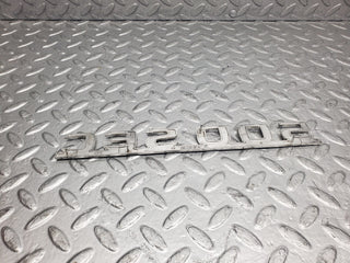 W126 Coupe trunk badge emblem used OEM