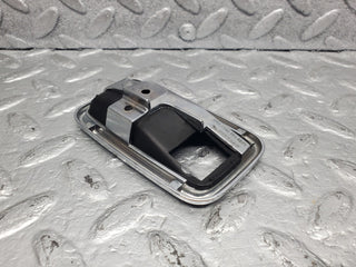 W123 Wagon chrome frame door opener left used OEM