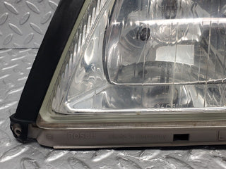 R129 SL xenon headlight left used OEM
