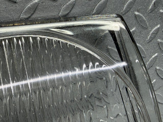 31058 Mercedes-Benz W123 200D Headlight Lens Hella Left Side 117683-00