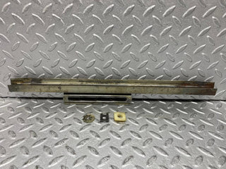 W109 front right door glass holder used OEM