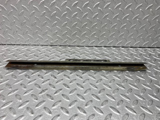 W109 front right door glass holder used OEM