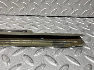 W109 front right door glass holder used OEM