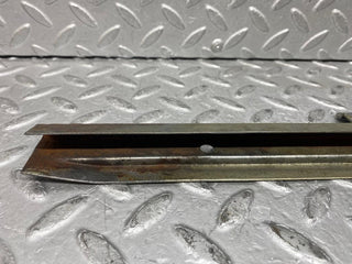 W109 front right door glass holder used OEM