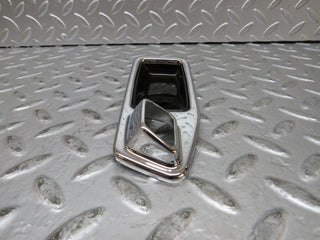 W123 chrome frame door opener front left used OEM