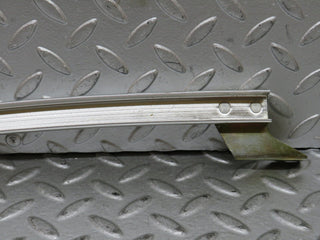 W123 rear left door chrome window channel used OEM