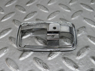 W123 chrome frame for door opener right used OEM