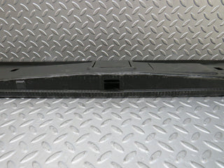 W124 trunk lock trim panel used OEM