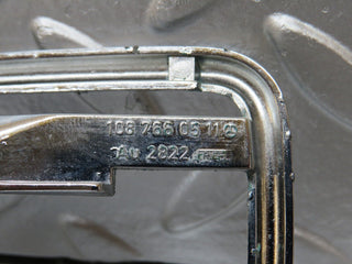 W123 door handle surround left used OEM