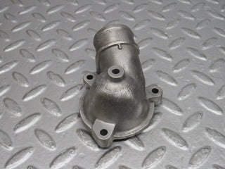 W124 Cabriolet thermostat housing used OEM
