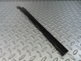 W123 left seat belt runner with cover used OEM