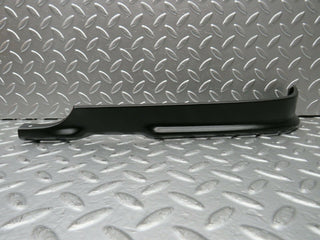 R107 SLC headlight lower trim left side used OEM